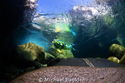 Behind the waterfall in the river by Michael Baukloh 